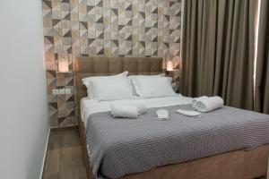 Posteľ alebo postele v izbe v ubytovaní Koios Apartments