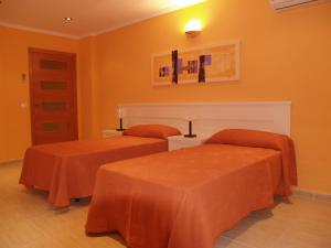 Postel nebo postele na pokoji v ubytování Apartamentos Turisticos de Hospedaje Don Diego