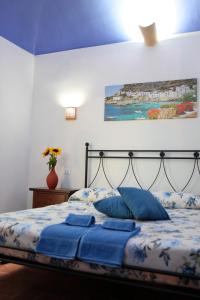 Cama o camas de una habitación en La Paranza Apartments