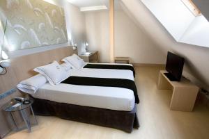 Cama o camas de una habitación en Hotel Opera