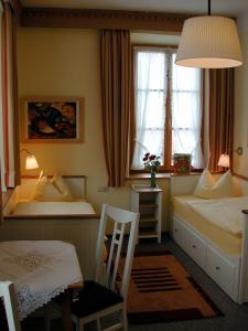 Postel nebo postele na pokoji v ubytování Hotel Waltraud Garni
