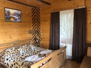 Postel nebo postele na pokoji v ubytování Kabanova Gora