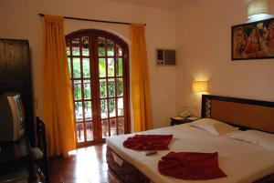 Postel nebo postele na pokoji v ubytování Sea Breeze Beach Resort Candolim, Goa + 15 fotografií