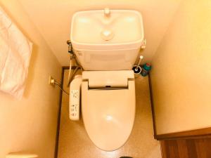 a bathroom with a toilet in a small room at YK Mansion Sannomaru - Vacation STAY 98241 in Kumamoto