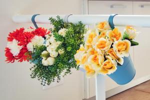 two bouquets of flowers are hanging on a wall at Sintra Bliss A Part in Sintra