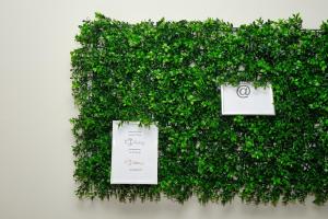 a wall of green ivy with signs on it at Sintra Bliss A Part in Sintra