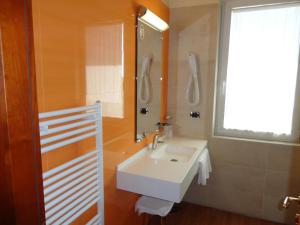 Koupelna v ubytování Hotel Confine