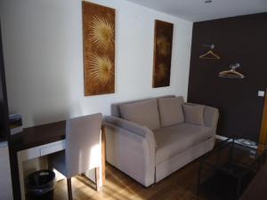 Posezení v ubytování Hotel de la Lande