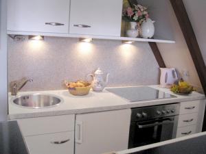 a kitchen with a sink and a counter top at Ferienhaus Bayern in Siegsdorf