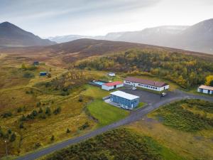 an aerial view of a farm with a building at Soti Lodge in Fljot