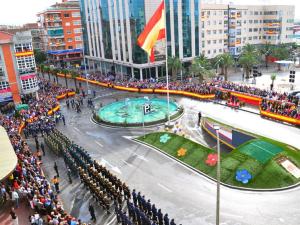 a large crowd of people standing in a city at H Los Rafaeles in Torrejón de Ardoz
