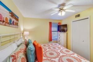 a bedroom with a bed and a ceiling fan at Phoenix 6 Unit 802 in Orange Beach +49 photos