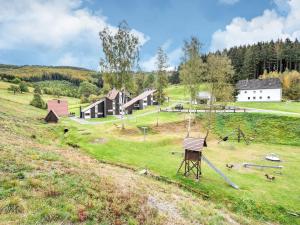 an aerial view of a farm with a house at Charmantes Ferienhaus in Skigebietsnähe in Schmallenberg +31 photos