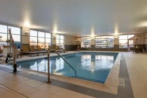 a large swimming pool in a hotel room at Hyatt House Oak Brook in Oak Brook