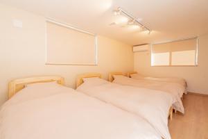Postel nebo postele na pokoji v ubytování Fuji Fabric Stay