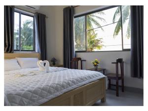 Postel nebo postele na pokoji v ubytování Chamisland Hanhly homestay