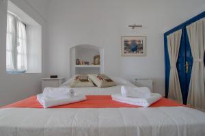 A bed or beds in a room at Astraea House