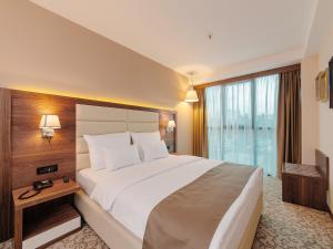 Katil atau katil-katil dalam bilik di Hotel New Star
