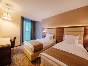 Katil atau katil-katil dalam bilik di Hotel New Star