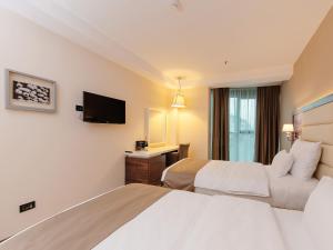 Katil atau katil-katil dalam bilik di Hotel New Star