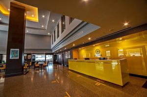 The lobby or reception area at Le cassia Hotel