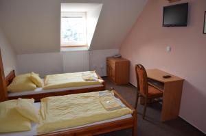 Voodi või voodid majutusasutuse Hotel Na Statku toas