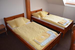Voodi või voodid majutusasutuse Hotel Na Statku toas