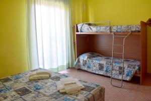 a bedroom with two bunk beds and a ladder at Casa per Ferie Nostra Signora Tonfano in Marina di Pietrasanta +51 photos