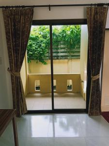 a view of a room with a large window at Rachawadee House in Phangnga