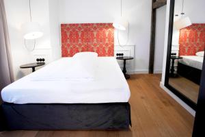 Letto o letti in una camera di Hotel Schwarzwälder Hof