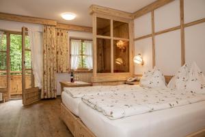 En eller flere senger på et rom på Hotel-Gasthof "Zur Mühle"