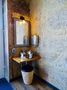 Ett badrum på Poveira Hotel
