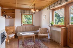 a living room with a couch and a table at App Schlern - Gasser in Vols am Schlern