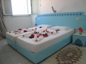 Un pat sau paturi într-o cameră la Houria House Sable D'or