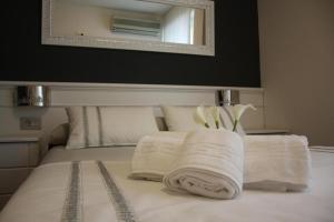 Postel nebo postele na pokoji v ubytování Hotel Herreros