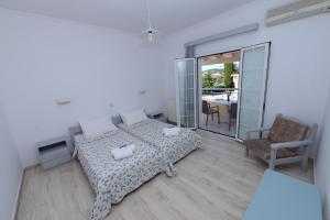 Postel nebo postele na pokoji v ubytování Filippas Rooms in Gouvia
