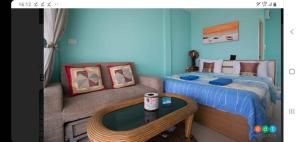 Ein Bett oder Betten in einem Zimmer der Unterkunft Baan Saithong