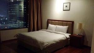 Postel nebo postele na pokoji v ubytování Vabien Suite 1 Serviced Residence