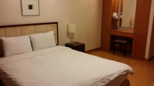 Postel nebo postele na pokoji v ubytování Vabien Suite 1 Serviced Residence