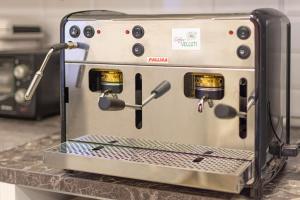 a coffee machine sitting on a counter in a kitchen at B&B A Picture of Rome in Rome