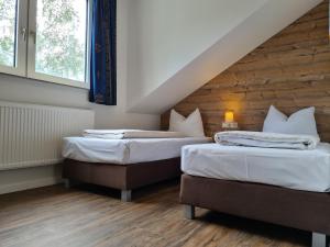 Letto o letti in una camera di Hotel Winterberg Resort