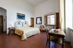 Postel nebo postele na pokoji v ubytování B&B San Gimignano Diffuso
