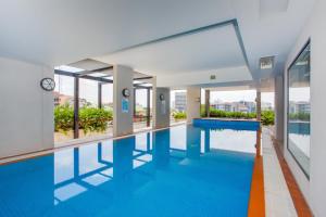 a swimming pool with a view of a building at Republic Apartments Brisbane City in Brisbane