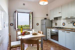 Kuchyň nebo kuchyňský kout v ubytování B&B San Gimignano Diffuso