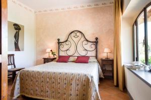 Postel nebo postele na pokoji v ubytování B&B San Gimignano Diffuso
