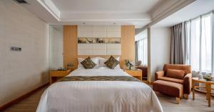 Cama ou camas em um quarto em Yungang Jianguo Hotel