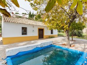 a villa with a pool in front of a house at 2 bedrooms house with private pool enclosed garden and wifi at Albanchez de Magina in Albanchez de Úbeda