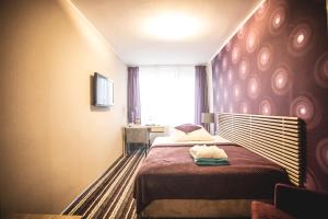 เตียงในห้องที่ Hotel New Wave