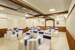 a conference room with tables and chairs in it at Lazy Lagoon, Baga A Lemon Tree Resort, Goa in Baga