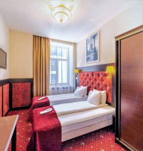 Postel nebo postele na pokoji v ubytování Rixwell Old Riga Palace Hotel